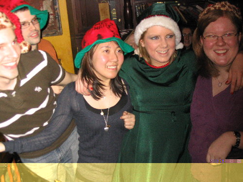 Group photo of all the recipients who received Christmas Hats to wear. Girl in Green outfit is O'Byrne's Staff.